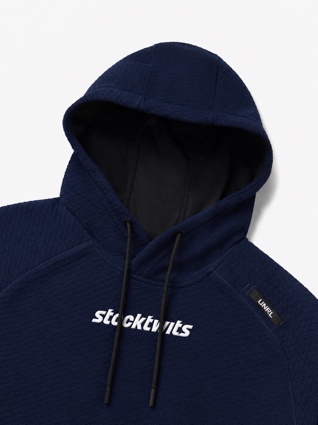 Close-up of the hood, drawcords and embroidered Stocktwits wordmark